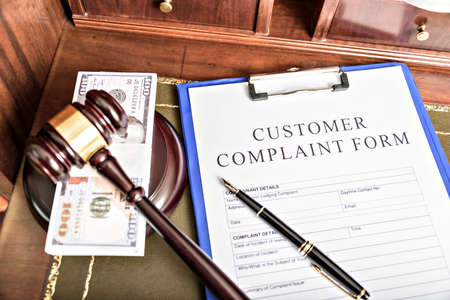 Close up on a file tab with the word complaints, focus on the main text and blur effect. Concept image for illustration of Customer Service complaint management.の写真素材
