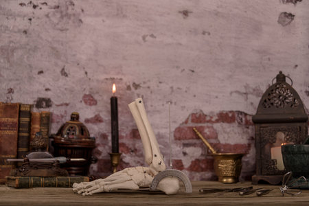 Old doctors desk. still life of instruments and bone parts typical of a doctor of the time.の写真素材