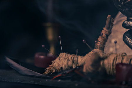 Witchcraft composition with burning candles, jewelry and pentagram symbol. Halloween and occult concept, black magic ritual.の写真素材
