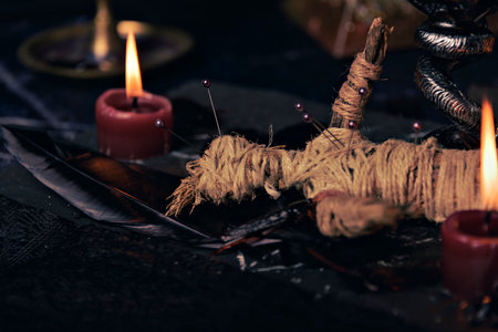 Witchcraft composition with burning candles, jewelry and pentagram symbol. Halloween and occult concept, black magic ritual.の写真素材