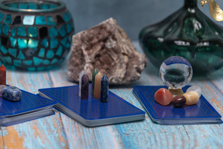An intimate tarot reading session arrangement featuring vibrant crystals, tarot cards, and a geode...