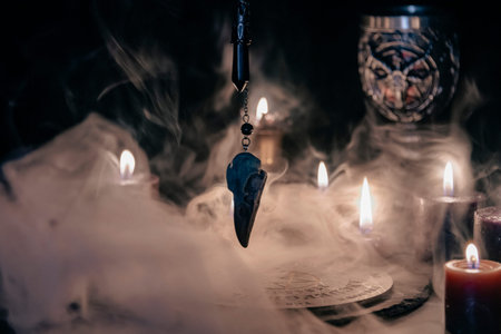 A mysterious and atmospheric occult setting featuring a pendulum swinging over a mystic symbol,...
