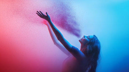 An artistic shot of a woman releasing colorful powder into the air, with soft pink and blue lighting. The dynamic movement creates a magical and ethereal atmosphere.の素材