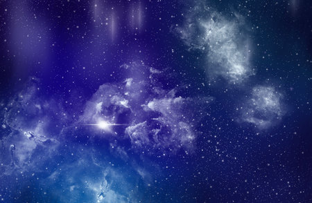 Galaxy in the blue clouds floating above the black background atmosphereの写真素材