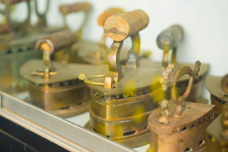 Ancient iron in the cabinet in the old house.の写真素材