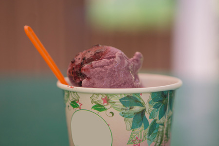 ice cream in metal cup on kitchen table backgroundの写真素材