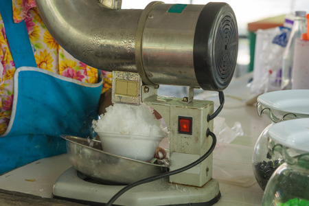He is making a dessert, ice cream maker.の写真素材
