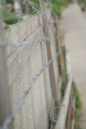 The barbed house surrounded by barbed wire.の写真素材