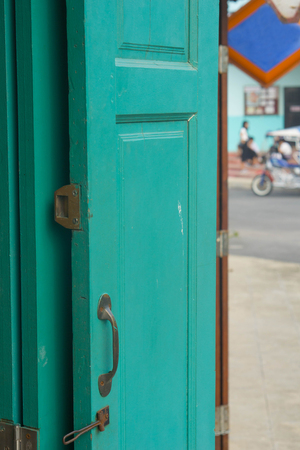 The old green door was opened.の写真素材