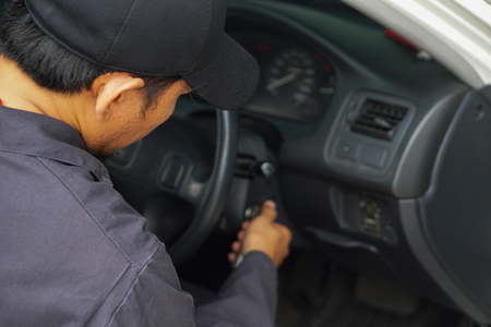 Car mechanic is checking the machine.の写真素材