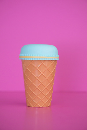 Plastic cup Pink background.の写真素材