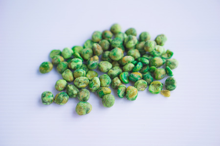 Pile of green wet pea isolated on gray background.の写真素材