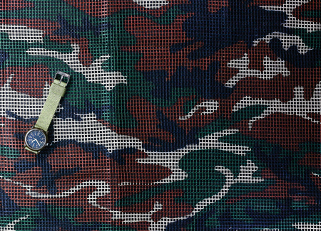 Watch on  camouflage net backgroundの写真素材
