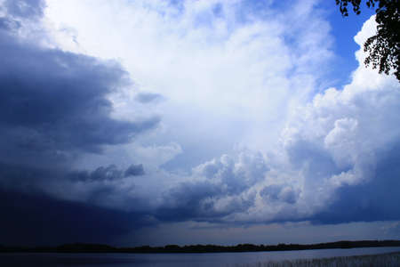 Storm is coming. A massive thunderstorm is approaching towards the shoreの写真素材
