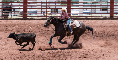 11 year old girl in the Professional Rodeo at the Mescalero Apache Ceremonial & Rodeo grounds, Mescalero, New Mexico, America - 2 Jul 2016のeditorial素材