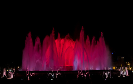 An evening water fountain show in Barcelonaの写真素材