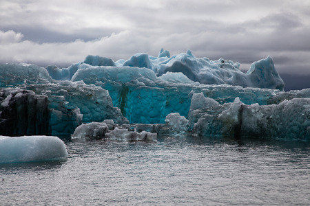 Blue Iceberg floating in the water in the Jokulsarlon Glacier Lagoon, Icelandの写真素材