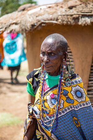 MASAI MARA, KENYA â AUGUST 15.  Maasai Woman in full ceremonial dress in a Maasai Village in the Masai Mara, Kenya â 15 Aug 2019のeditorial素材