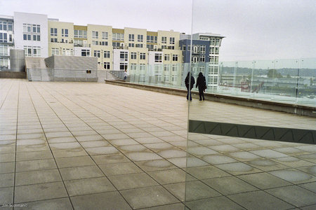 2 Hooded Figures on a large plaza. Tacoma,WA Date unknown.  