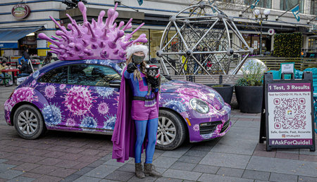 A Covid-19 awareness person on the street .のeditorial素材