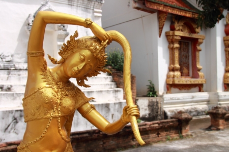 Goddess of the earth squeezing water from her hair to protect the Buddha after enlightenment  Wat Prasat, Chiang Mai, Thailandの写真素材
