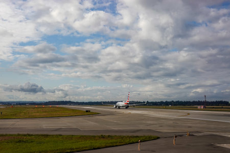 Seattle, WA/USA-9/16/19: An American Airlines jet airplane taking off of the runway at the Seattle...