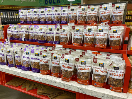 Orlando,FL/USA-5/3/20: A display of bags of Almonds and Pecans at a Whole Foods Grocery Store.