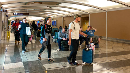 Orlando, FL USA - February 19, 2020:  People walking to Delta departure gates at the Orlando International Airport.のeditorial素材