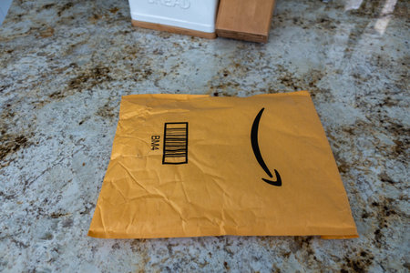 Orlando,FL/USA-8/20/19:  An Amazon package ordered online and delivered to a home sitting on a kitchen counter.のeditorial素材