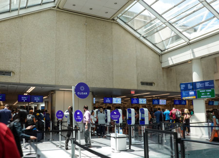 Orlando, FL/USA-8/22/19: Airport security at a busy international airport with Clear, TSA precheck and TSA standard screening.のeditorial素材