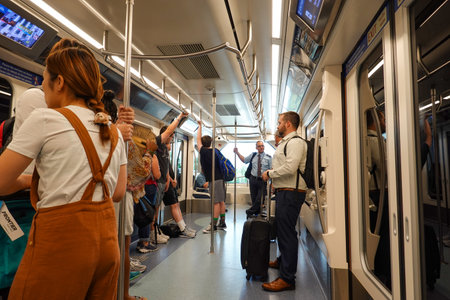 Orlando, FL/USA-8/22/19: People  on a train being trasported to an airport gate.のeditorial素材