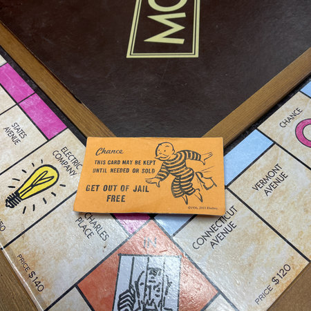 Orlando,FL USA - January 25, 2021:  A get out of Jail Free card from a monopoly set.  Concept pardon, presidential, business, banking and finance.のeditorial素材