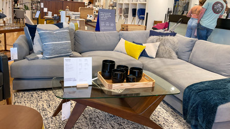 Orlando, FL USA- March 6, 2021 :  A sectional couch and tables  at a West Elm Midcentury Modern...
