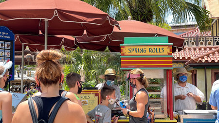 Orlando, FL USA - May 2, 2021:  People waiting in line to buy Cheeseburger and Pepperoni Spring...