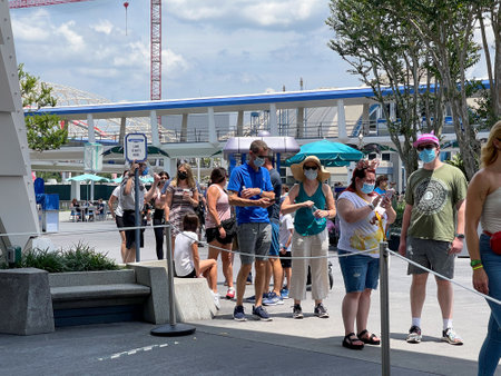 Orlando, FL USA - May 2, 2021 - People waiting in line to ride the Peoplemover at Disney World Magic Kingdom in Orlando, Florida.のeditorial素材