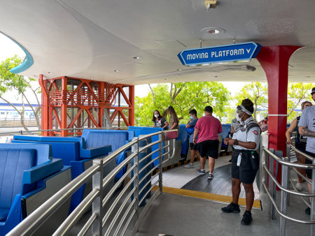Orlando, FL USA - May 2, 2021 - People getting on the Peoplemover ride at Disney World Magic Kingdom in Orlando, Florida.のeditorial素材