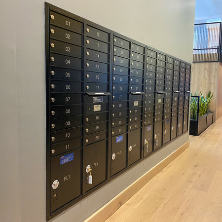 Orlando, FL USA - August 5, 2020:  A United Post Office hub locker in an apartment complex where packages are delivered safely to residents.のeditorial素材