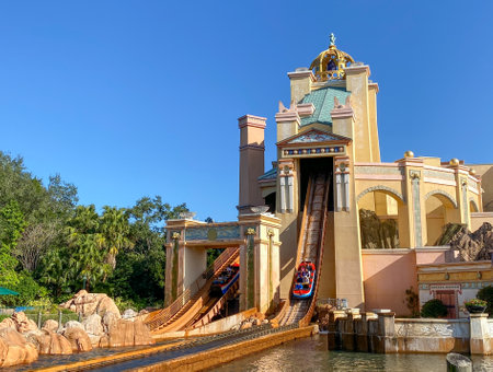 Orlando, FL USA - December 25, 2019:  The Journey to Atlantis Roller Coaster water ride at SeaWorld in Orlando, Florida speeding around the track and splashing into the water.のeditorial素材