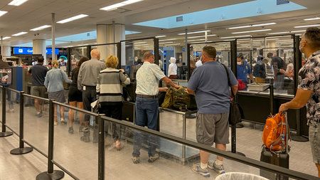 Orlando, FL USA - September 23, 2021:  People walking through the security line at Orlando...