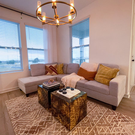 Orlando, FL USA - February 6, 2021:  A living room area with midcentury moden furniture in a condominium model home in Orlando, Florida.のeditorial素材