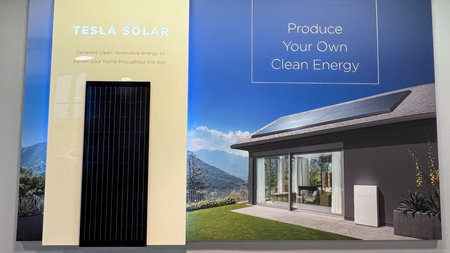 Orlando, FL USA - November 5, 2021:  The Tesla Powerwall and Solar Sign at the entrance of the Tesla...