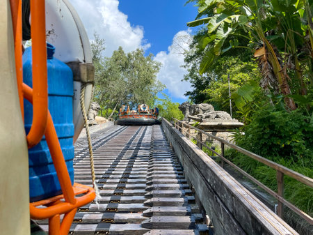 Orlando, FL USA - October 2, 2021:  The Kali River Rapids ride rafts going up a ramp at Disney World Animal Kingdom.のeditorial素材
