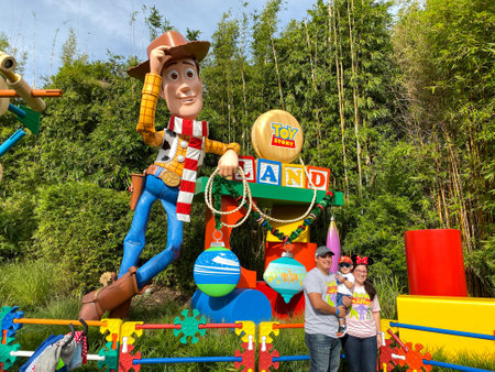 Orlando, FL USA-November 27, 2019:  People possing for a photo in front of the  Story Land sign in Hollywood Studios in Orlando, Florida.のeditorial素材