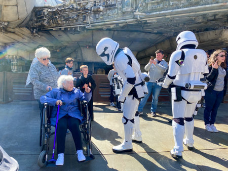 Orlando, FL USA- February 28, 2020: Storm Troopers talking to a senior woman in the Star Wars area  in Hollywood Studios Walt Disney World in Orlando, Florida.のeditorial素材