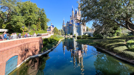 Orlando, FL USA - December 2, 2021 : A view of Cinderall Castle and the reflection on a pond at Walt Disney World Magic Kingdom in Orlando, Florida.のeditorial素材