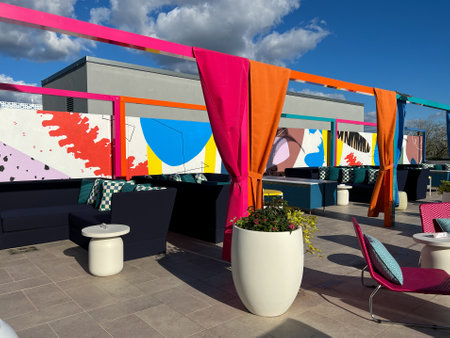 Orlando, FL USA -  December 23 2021: The outdoor amenities with a swimming pool, cabanas and lounge chairs at the Wave Hotel at Lake Nona in Orlando, Florida.のeditorial素材