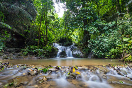 Waterfall in green jungle in Sangkhlaburi Thailandの写真素材