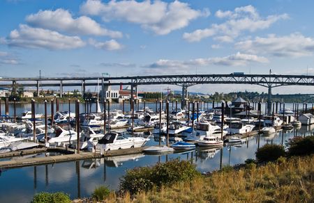 Boats docked by the river in Portland, Oregonの写真素材