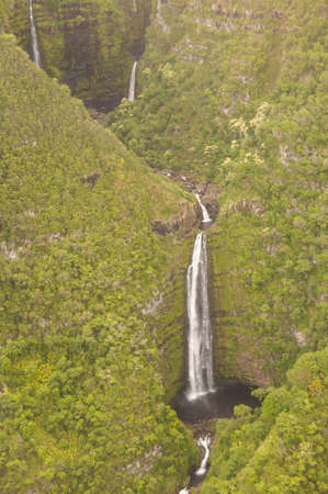 An aerial view of cascading waterfalls on the Hawaiian island of Molokaの写真素材