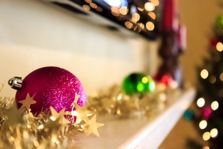 Sparkling purple ornament on mantleの写真素材